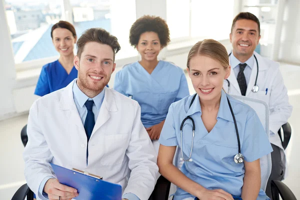 Group of happy doctors on seminar at hospital — Stock Photo, Image