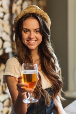 happy young woman drinking water at bar or pub clipart