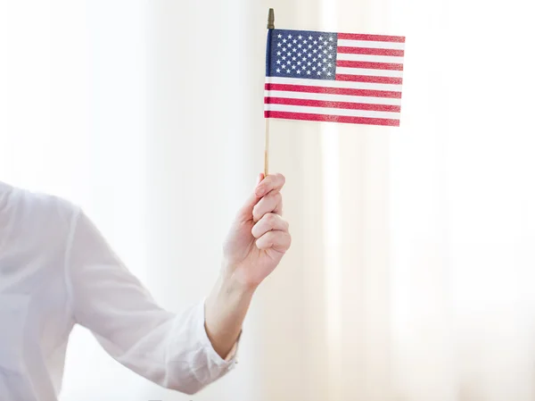 Close up of woman holding american flag in hand Stock Image