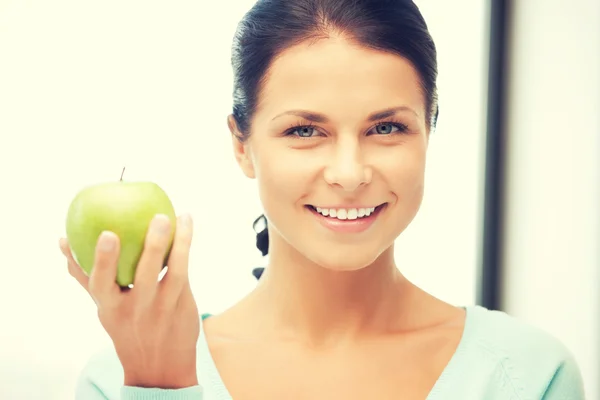 Lovely housewife with green apple — Stock Photo, Image