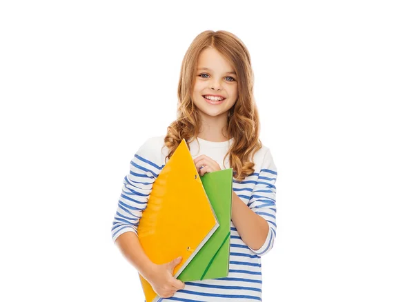 Criança segurando pastas coloridas — Fotografia de Stock