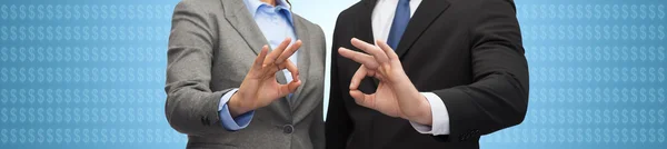 Businessman and businesswoman showing ok sign — Stock Photo, Image