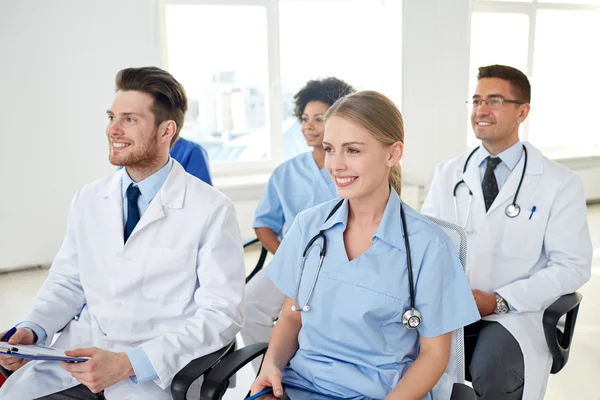 Group of happy doctors on seminar at hospital — Stock Photo, Image