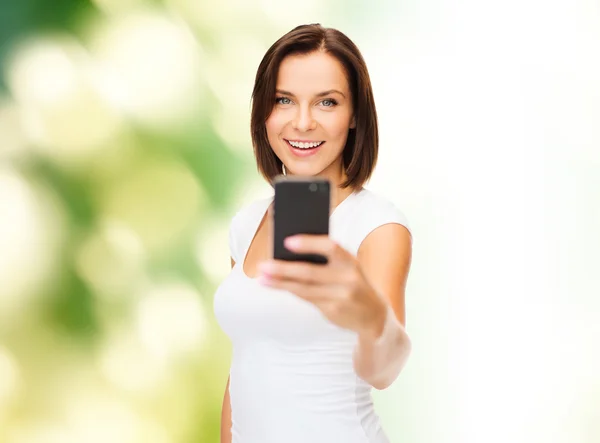 Woman taking selfie with smartphone — Stock Photo, Image