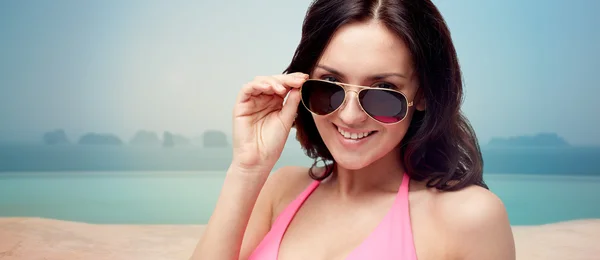 Happy woman in sunglasses and swimsuit — Stock Photo, Image