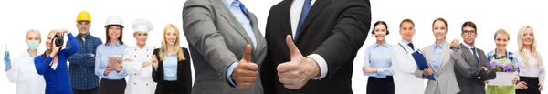 Businessman and businesswoman showing thumbs up — Stock Photo, Image