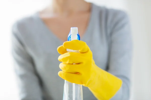 Close up of happy woman with cleanser spraying — Stock Photo, Image