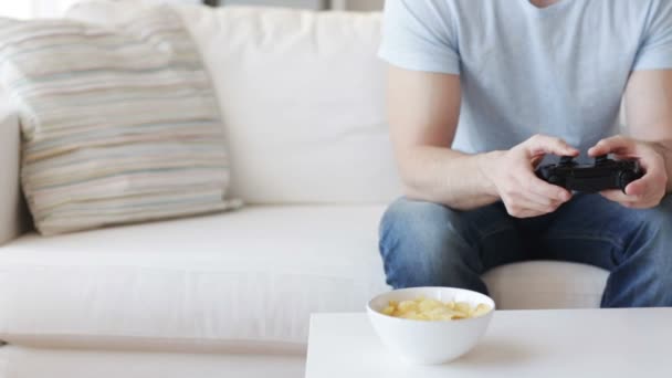 Close up of man playing video game at home — Stock Video