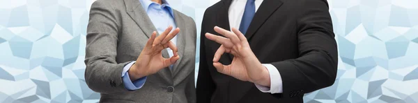 Businessman and businesswoman showing ok sign — Stock Photo, Image