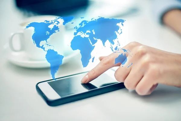 Close up of woman hand with smartphone and map — Stock Photo, Image