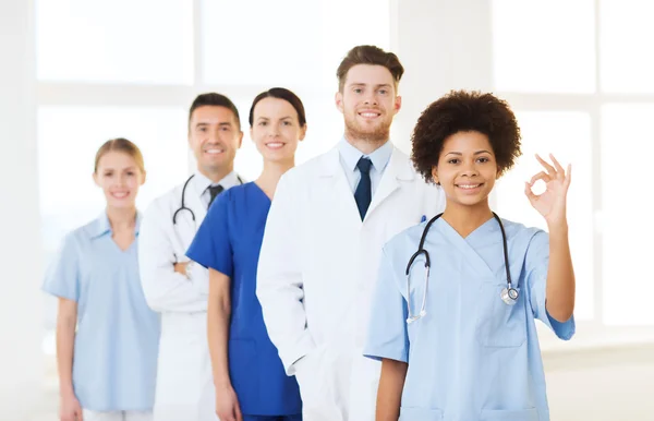 Group of happy doctors at hospital — Stock Photo, Image