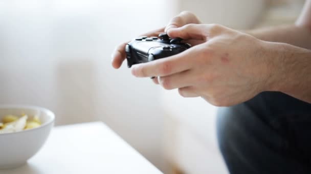 Close up of man hands playing video game at home — Stock Video