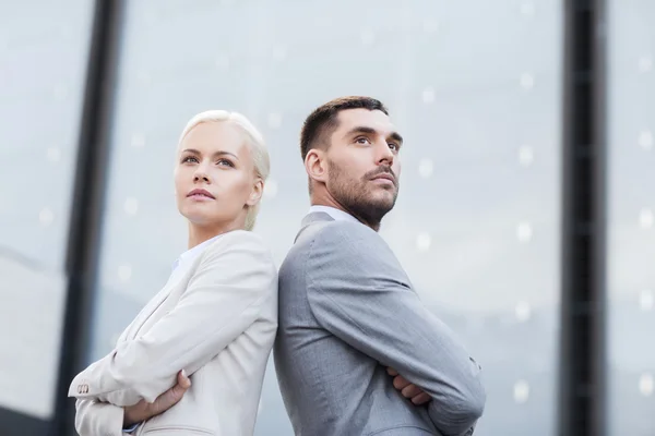 Businessman and businesswoman outdoors — Stock Photo, Image