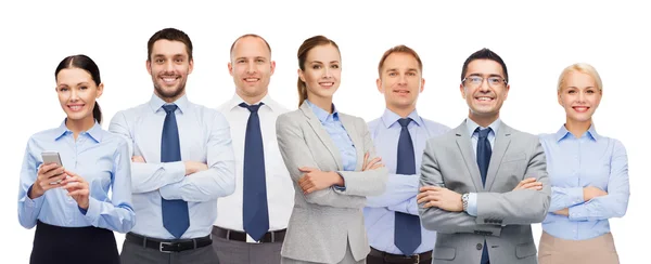 Groep gelukkige zakenmensen met gekruiste armen — Stockfoto