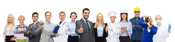 Zufriedene Geschäftsleute über professionelle Arbeiter — Stockfoto