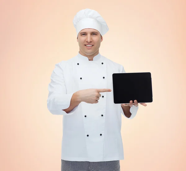 Cozinheiro chef masculino feliz mostrando com tablet pc — Fotografia de Stock