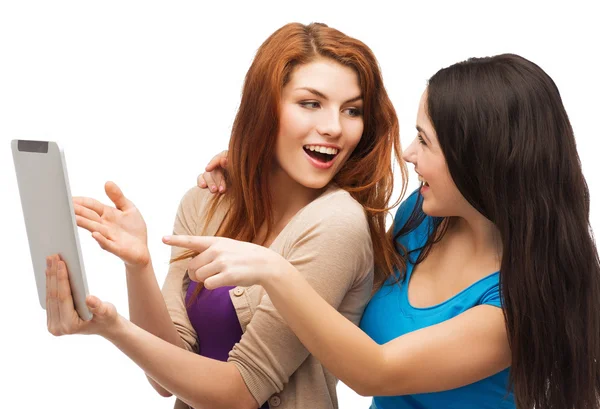 Two smiling teenages with tablet pc computer — Stock Photo, Image