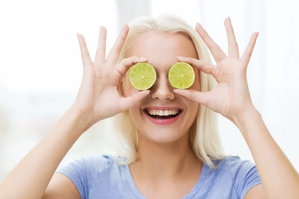 Happy woman having fun covering eyes with lime — Φωτογραφία Αρχείου