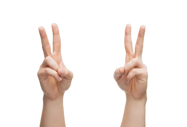 Man hands showing v-sign Royalty Free Stock Photos