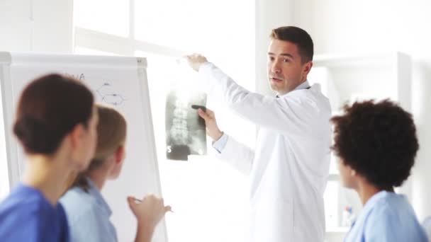 Group of happy doctors with x-ray at hospital — Stock Video