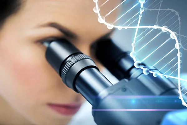Close up of scientist looking to microscope in lab — Stock Photo, Image