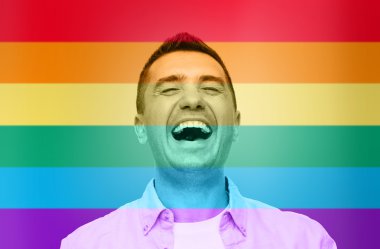 laughing man over rainbow flag stripes background clipart