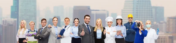 Happy businessman over professional workers — Stock Photo, Image