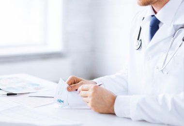 male doctor writing prescription paper clipart