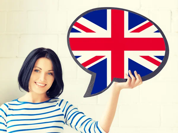 Metin kabarcık İngiliz bayrağı ile gülümseyen kadın — Stok fotoğraf