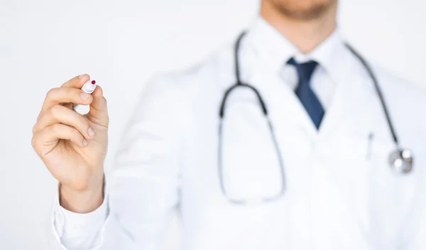 Doctor writing something in the air — Stock Photo, Image