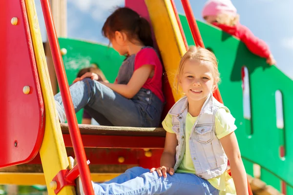 Happy kids on children playground — Stock Photo, Image