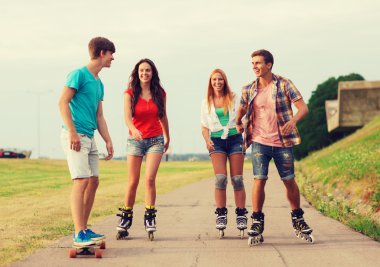 group of smiling teenagers with roller-skates clipart