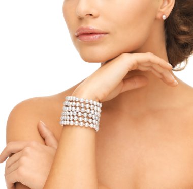 woman with pearl earrings and bracelet clipart