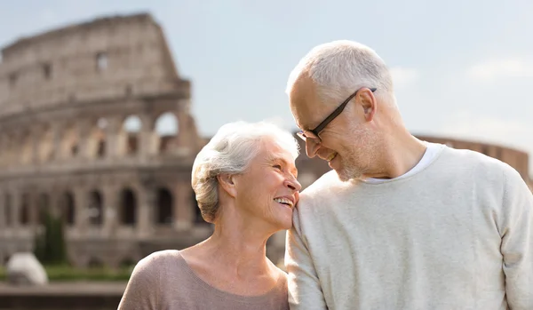 Happy senior couple over coliseum in rome, italy — 图库照片