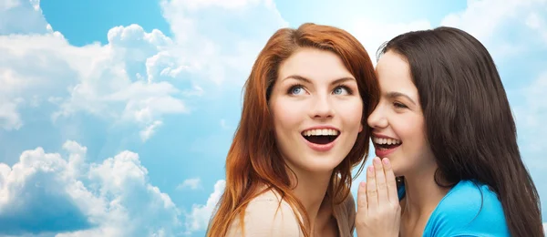 Teenage girls or women whispering gossip — Stok fotoğraf