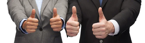 Бизнесмен и предпринимательница, показывающая большие пальцы вверх — стоковое фото