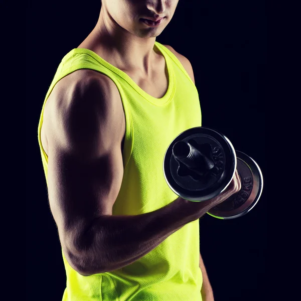 Close up of young man with dumbbell — Stock Photo, Image