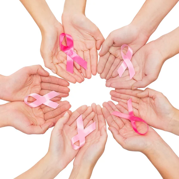 Close up of hands with cancer awareness symbol — Stock Photo, Image