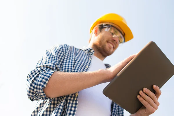 Close up of builder in hardhat with tablet pc — Stock Photo, Image