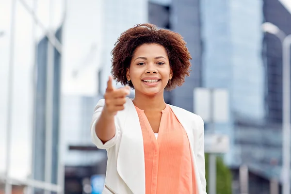 Happy african businesswoman pointing finger on you — Stockfoto