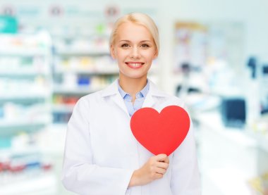 woman pharmacist with heart at drugstore clipart