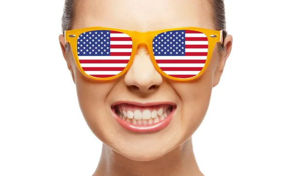 Angry teenage girl in glasses with american flag — Zdjęcie stockowe