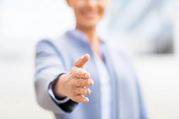 Close up of woman giving hand for handshake — Stockfoto