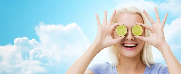 Happy woman having fun covering eyes with lime — ストック写真