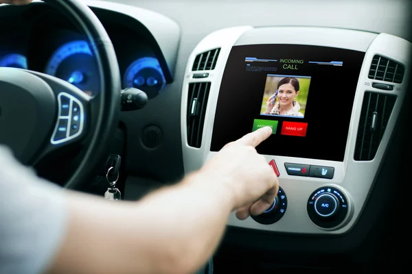 Male hand receiving video call on car panel screen — Stock Photo, Image