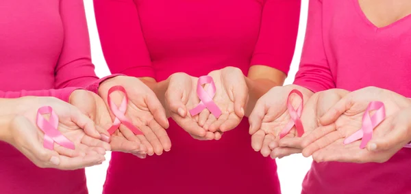 Close up of women with cancer awareness ribbons — Stock Photo, Image