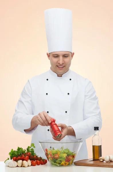 Happy male chef cook cooking food Stock Image