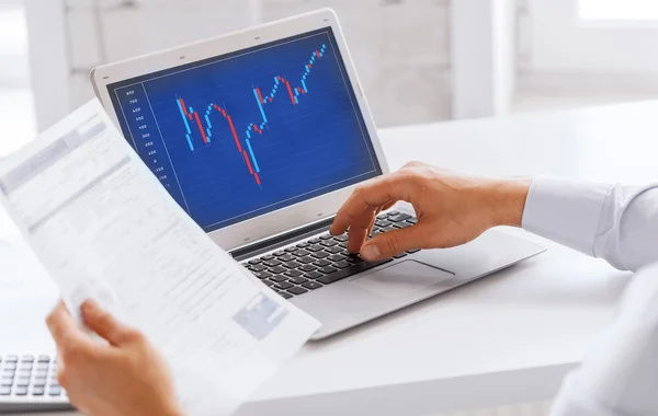 Businessman working with forex chart in office — Stock Photo, Image