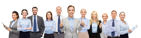 Group of happy businesspeople showing thumbs up — Stock Photo, Image