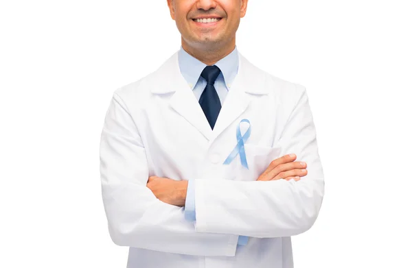 Happy doctor with prostate cancer awareness ribbon — Stock Photo, Image